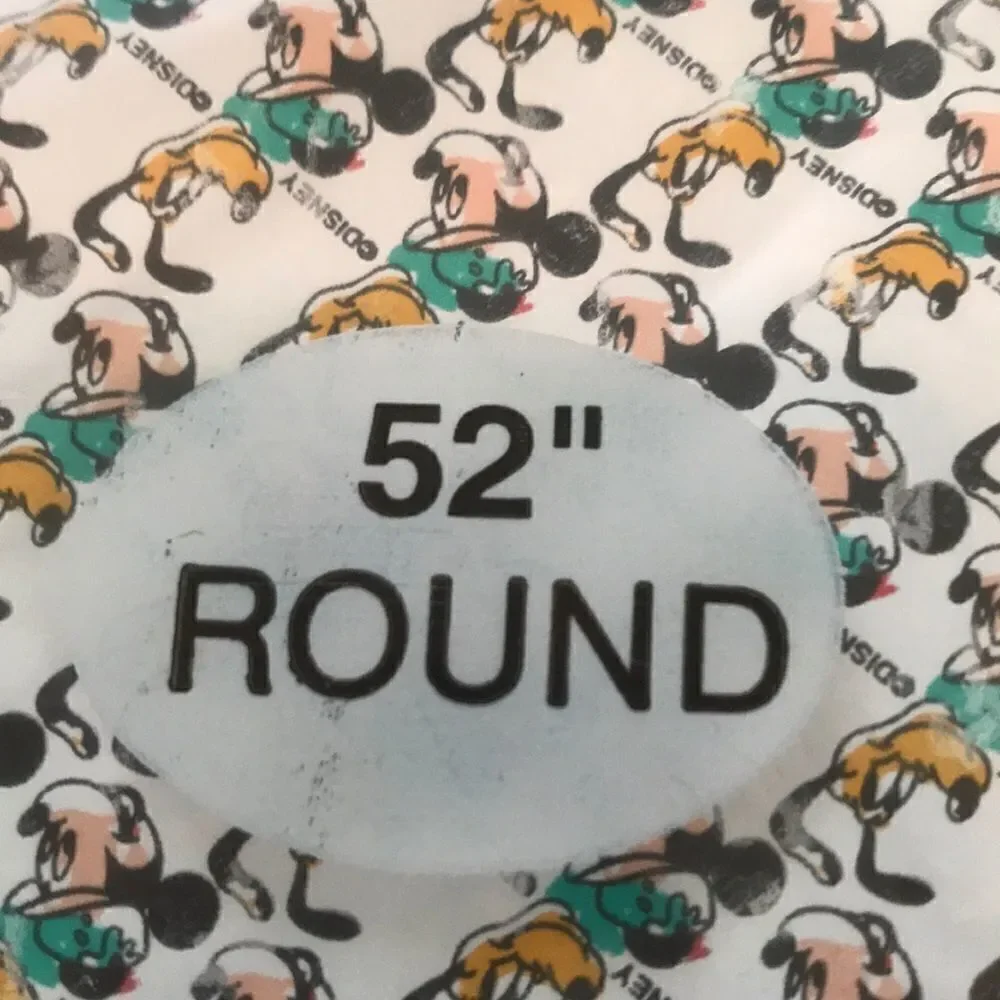 Vintage Mickey Mouse and Pluto plastic tablecloth.